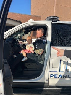 Police officer with child in police car