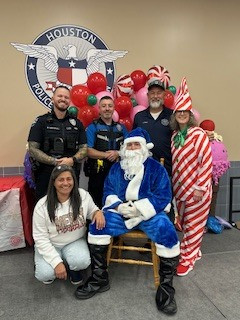 Police officers with Blue Santa